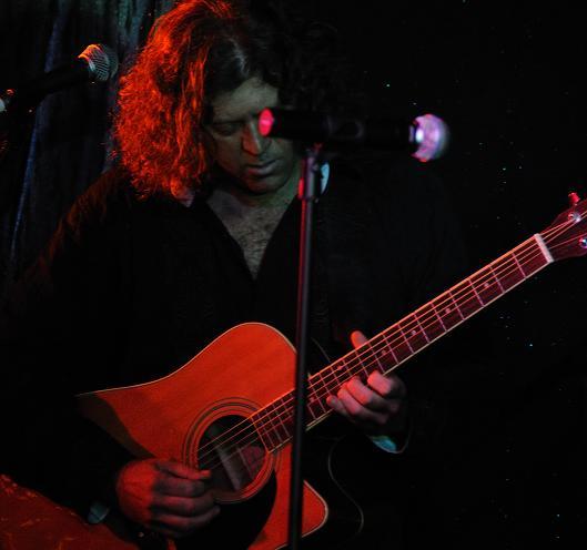 Ty Weatherly on acoustic guitar.